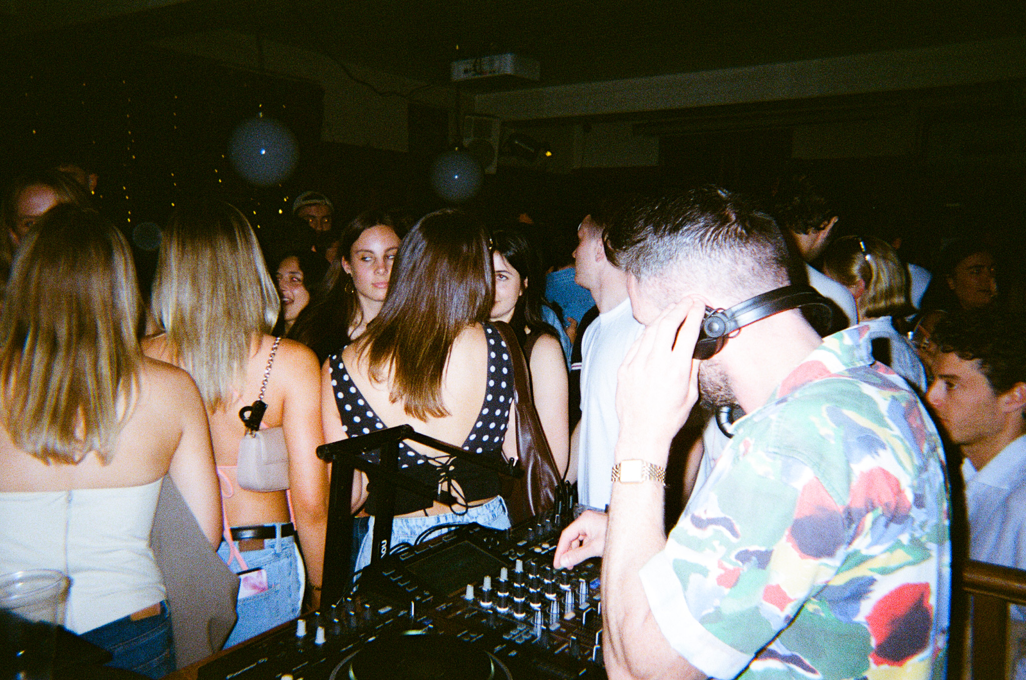 Photo of DJ playing to a crowd in the pub.